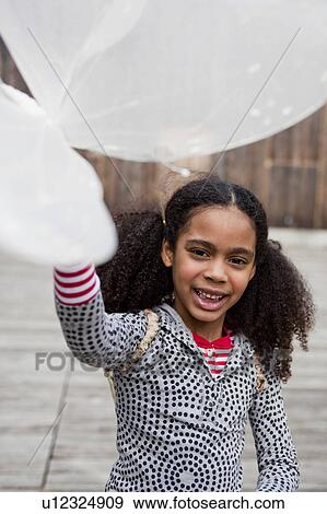 young girl playing with toy wings View Large Photo Image Stock Photo - young girl playing with toy wings. Fotosearch