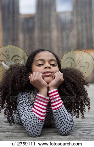 young girl resting her head on her hands View Large Photo Image Stock Image - young girl resting her head on her hands. Fotosearch