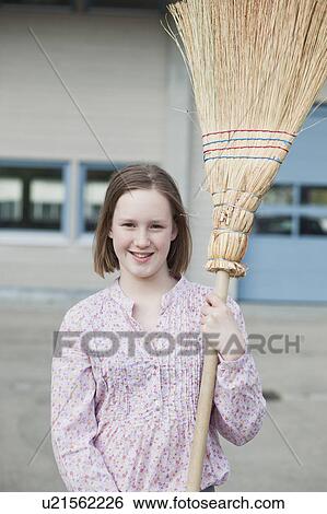 young girl with broom smiling View Large Photo Image Stock Photograph - young girl with broom smiling. Fotosearch