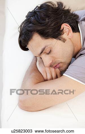 Stock Image - young man sleeping. Fotosearch