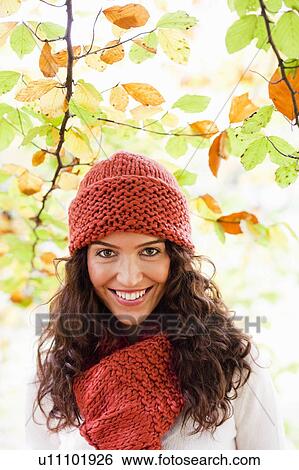 Stock Photograph - young woman below trees. Fotosearch