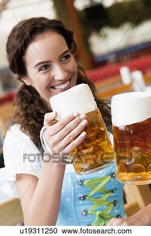 Young Woman Clinking Glasses View Large Photo Image Stock Image - Young Woman Clinking Glasses. Fotosearch