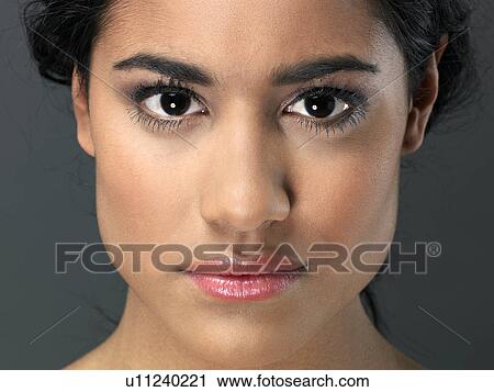 Young woman, close-up View Large Photo Image Stock Image - Young woman, close-up. Fotosearch