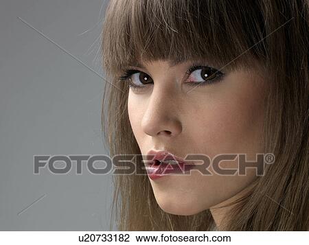 Young woman, close-up View Large Photo Image Stock Image - Young woman, close-up. Fotosearch