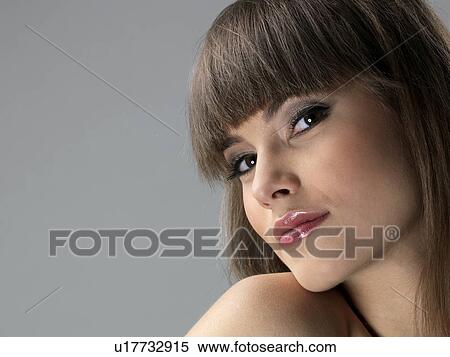 Young woman, close-up View Large Photo Image Stock Photography - Young woman, close-up. Fotosearch