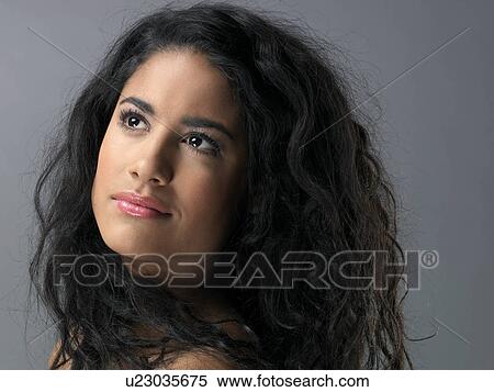 Young woman, close-up View Large Photo Image Stock Photography - Young woman, close-up. Fotosearch