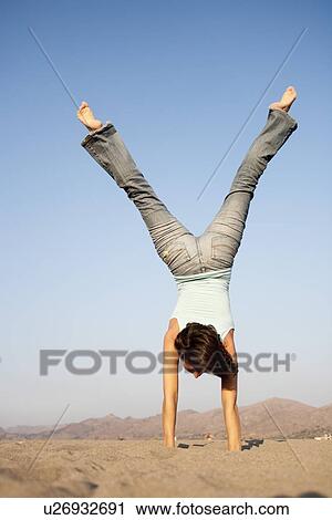 Young Woman Doing Handstand View Large Photo Image Stock Image - Young Woman Doing Handstand. Fotosearch