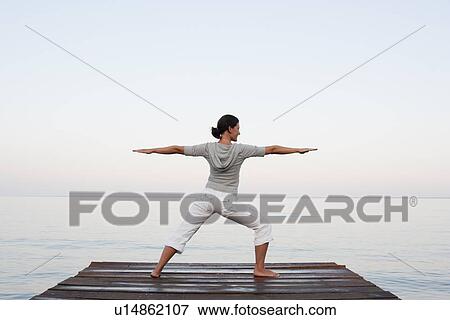 Young Woman Doing Yoga At Jetty View Large Photo Image Stock Photo - Young Woman Doing Yoga At Jetty. Fotosearch