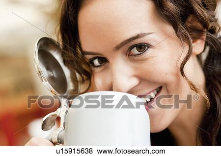Stock Photo - Young Woman Drinking Beer. Fotosearch