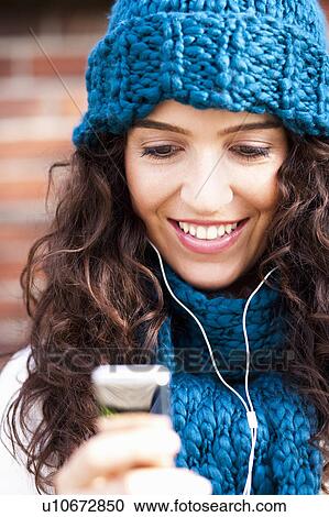 young woman hearing music View Large Photo Image Stock Image - young woman hearing music. Fotosearch