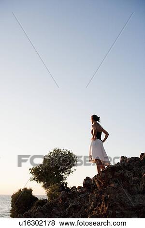 Stock Photo - Young Woman Looking At Seaside. Fotosearch