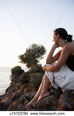 Stock Photography - Young Woman Looking At Seaside. Fotosearch