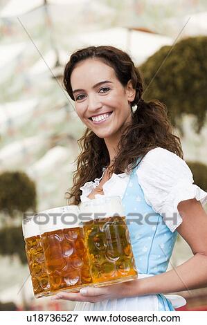Young Woman Serving Beer View Large Photo Image Stock Photo - Young Woman Serving Beer. Fotosearch