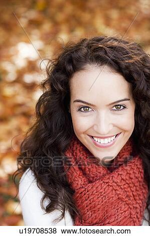 Stock Photo - young woman smiling to camera. Fotosearch