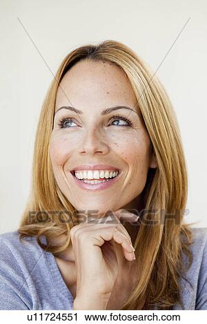 Stock Image - young woman thinking. Fotosearch