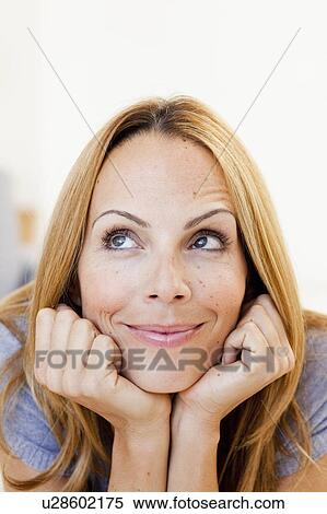 Stock Photography - young woman thinking. Fotosearch