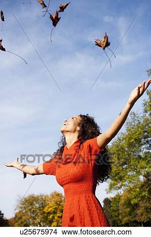 young woman under blue sky View Large Photo Image Picture - young woman under blue sky. Fotosearch