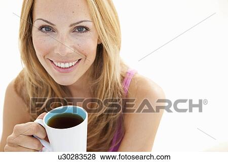 young woman with cup of tea portrait View Large Photo Image Stock Photo - young woman with cup of tea portrait. Fotosearch