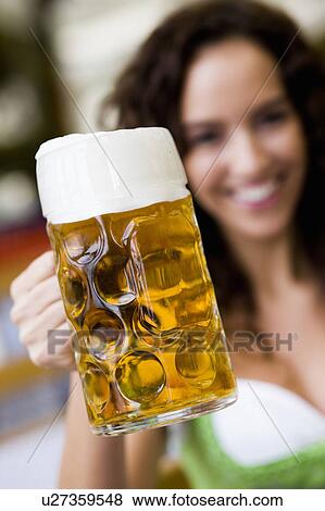 Young Woman With Glass Of Beer View Large Photo Image Stock Photo - Young Woman With Glass Of Beer. Fotosearch