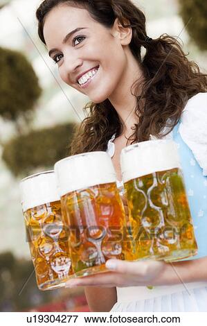 Young Woman With Glasses Of Beer View Large Photo Image Stock Photo - Young Woman With Glasses Of Beer. Fotosearch