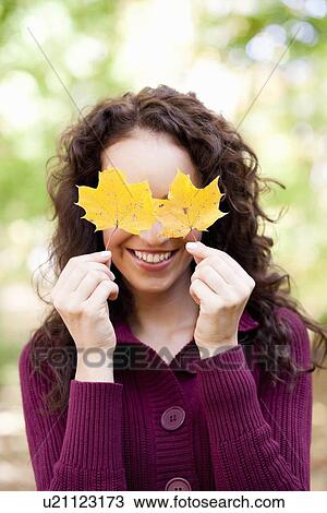 young woman with leaves View Large Photo Image Stock Image - young woman with leaves. Fotosearch