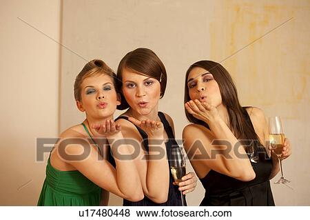 Young women blowing kisses View Large Photo Image Stock Photo - Young women blowing kisses. Fotosearch