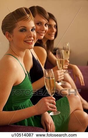 Young women drinking champagne View Large Photo Image Stock Photo - Young women drinking champagne. Fotosearch