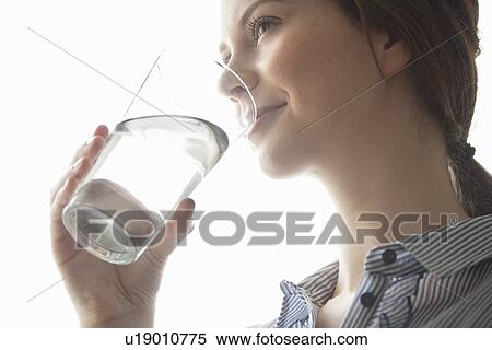 Young women drinking water View Large Photo Image Stock Photography - Young women drinking water. Fotosearch