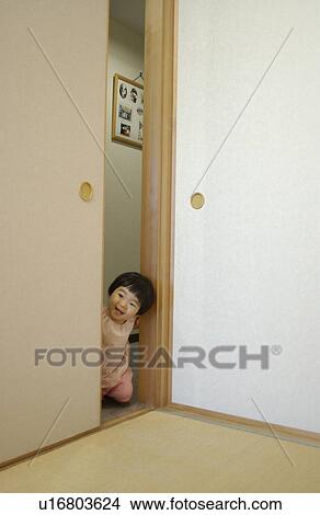 Baby girl peeking over fusuma View Large Photo Image Picture - Baby girl peeking over fusuma. Fotosearch