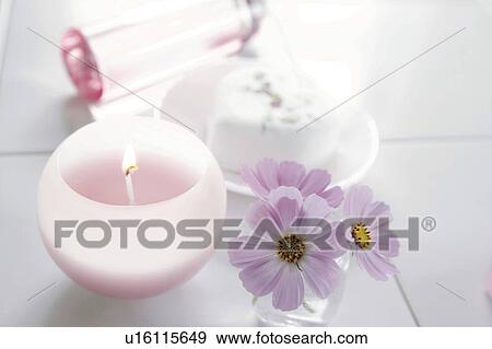 Stock Photo - Bathroom with candle and flowers. Fotosearch