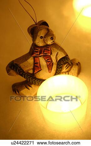 Stock Image - Bear decoration and candles. Fotosearch
