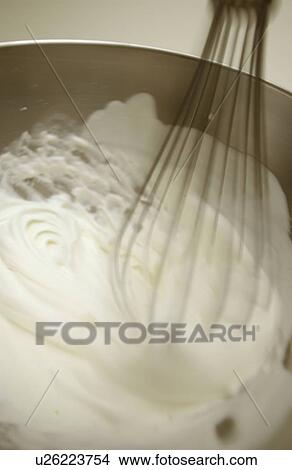 Picture - Bowl of whipped cream, close up, blurred motion. Fotosearch