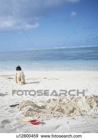 Boy on a beach View Large Photo Image Stock Photo - Boy on a beach. Fotosearch