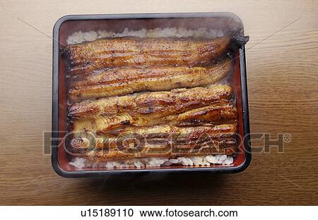 Stock Image - Broiled eel on rice in box. Fotosearch
