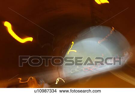 Picture - Car driving through tunnel. Fotosearch