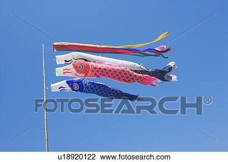 Stock Image - Carp streamers in sky, blue background. Fotosearch