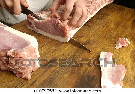Chef cutting meat View Large Photo Image Stock Image - Chef cutting meat. Fotosearch