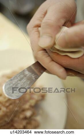 Picture - Chef making dim sum. Fotosearch