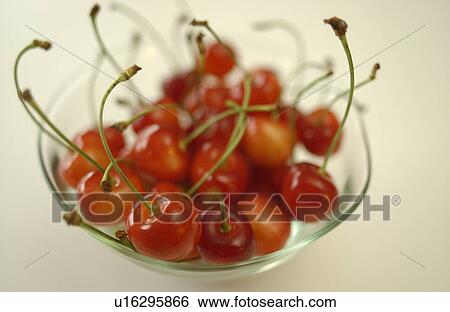 Stock Photograph - Cherries in bowl, white background. Fotosearch