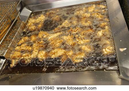 Chicken fried in deep fryer View Large Photo Image Stock Image - Chicken fried in deep fryer. Fotosearch