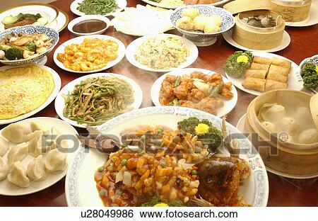 Stock Photograph - Chinese dishes on table, close up. Fotosearch