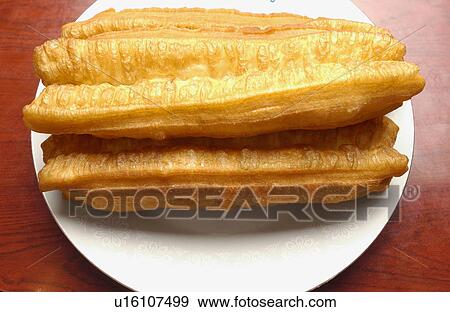 Chinese fried bread sticks on plate View Large Photo Image Stock Photo - Chinese fried bread sticks on plate. Fotosearch
