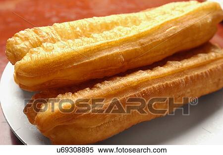 Chinese fried bread sticks on plate, close up View Large Photo Image Stock Photography - Chinese fried bread sticks on plate, close up. Fotosearch