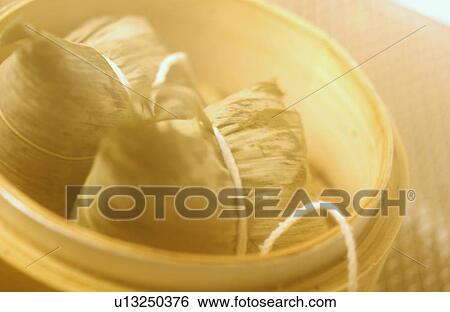Stock Photograph - Chinese rice balls in steamer, close up. Fotosearch