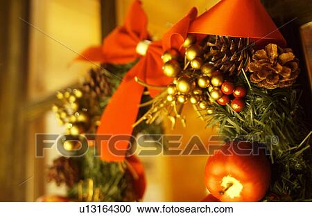 Christmas wreath on window, close up, long exposure View Large Photo Image Stock Image - Christmas wreath on window, close up, long exposure. Fotosearch