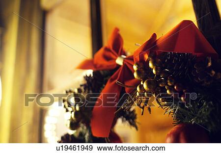 Christmas wreath on window, close up, long exposure View Large Photo Image Stock Photo - Christmas wreath on window, close up, long exposure. Fotosearch