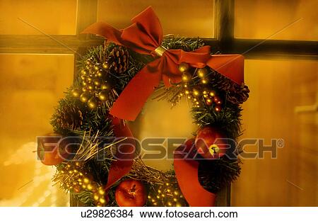 Christmas wreath on window, long exposure View Large Photo Image Picture - Christmas wreath on window, long exposure. Fotosearch