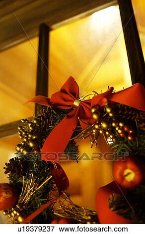 Christmas wreath on window, long exposure View Large Photo Image Stock Photo - Christmas wreath on window, long exposure. Fotosearch