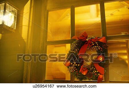 Christmas wreath on window, long exposure View Large Photo Image Stock Photo - Christmas wreath on window, long exposure. Fotosearch