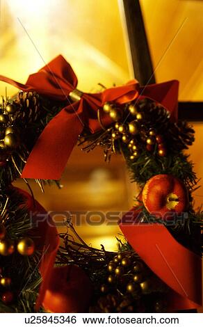 Christmas wreath on window, long exposure View Large Photo Image Stock Photograph - Christmas wreath on window, long exposure. Fotosearch